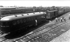 McKeen Motor Car #10 shunting 10 empty freight cars.